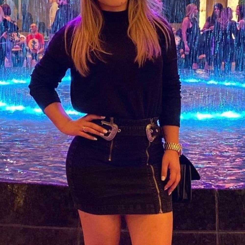 Belted black jean mini skirt